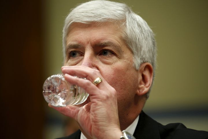 Michigan Gov. Rick Snyder (R) drinks some water as he testifies about Flint, Michigan's lead crisis in Washington on March 17, 2016. Snyder's approval ratings in his state have dropped significantly, according to an April poll.