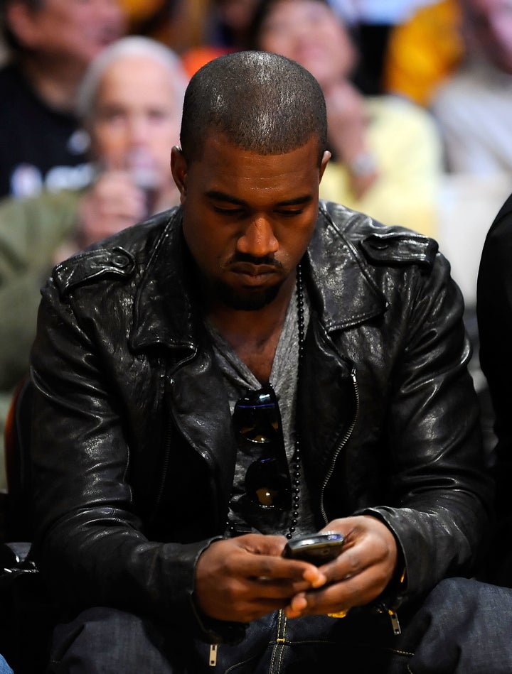 Here's Kanye on his phone in 2009.