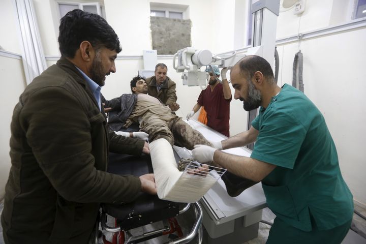 An Afghan man receives treatment at a hospital after a suicide car bomb attack in Kabul on Tuesday.