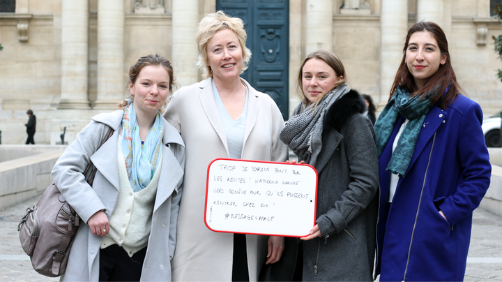 Davies has met many people along her trek to Geneva, including these students from Sorbonne University in Paris. They're holding a sign in French reading, "Too many Syrians are on the roads. Katherine is walking to Geneva so they can return home."
