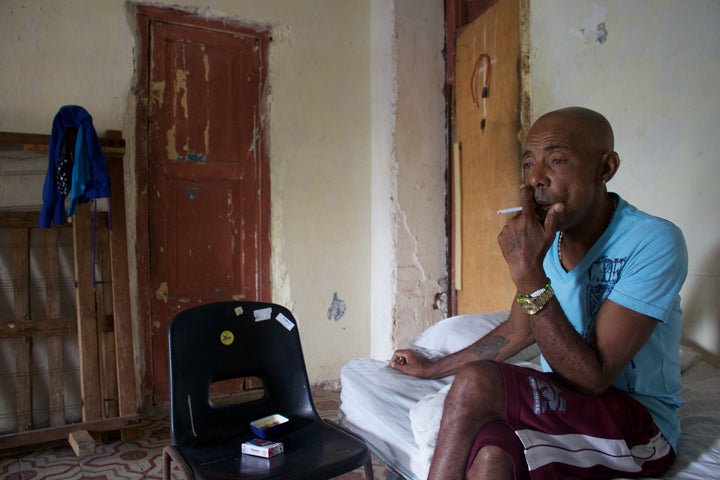 Francisco Jesús Jiménez, 58, smokes a cigarette in his apartment in the working-class neighborhood of Cayo Hueso, Havana. He is one of only about 2,200 Cubans to be deported from the U.S. since 1980.