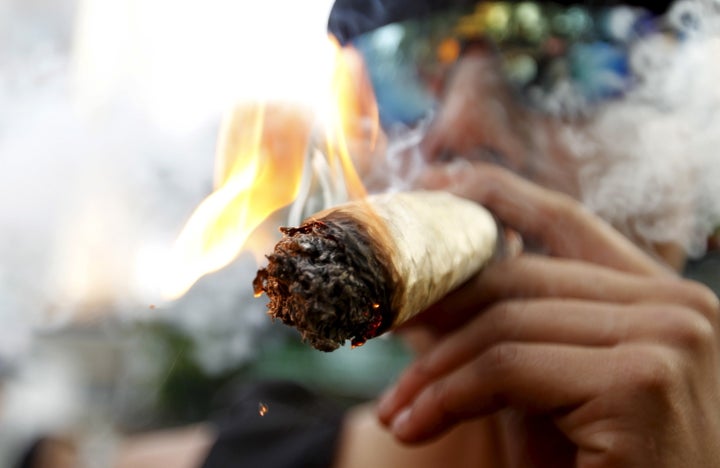 A man smokes marijuana during a demonstration in support of the legalization of marijuana in Medellin.