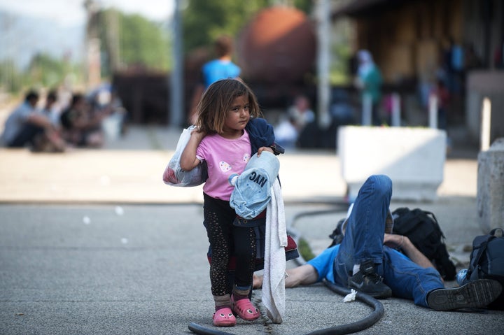 A girl walks at a train station waiting for a train to Serbia in the town of Gevgelija, on the Macedonian-Greek border, on J