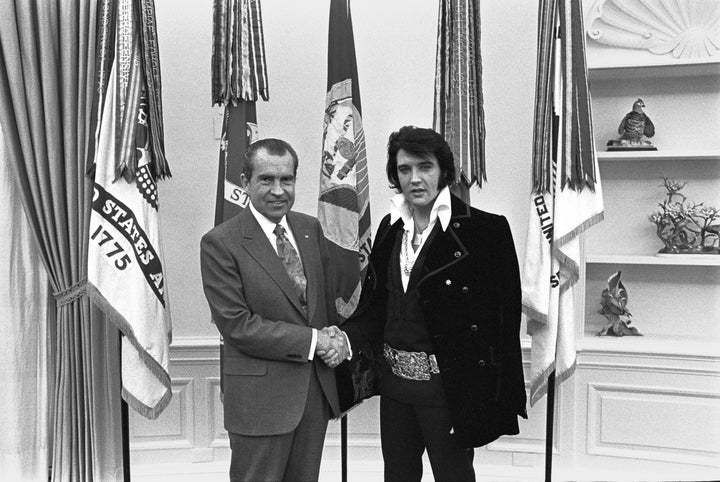 President Nixon shakes hands with Elvis Presley in the Oval Office in Washington, DC in December 1970 after the little-known meeting.