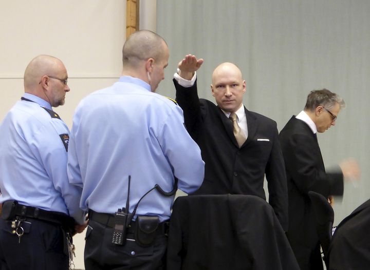 Mass killer Anders Behring Breivik raises his arm in a Nazi salute in court on 15 March 2016 