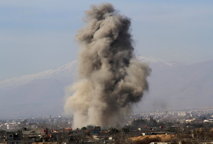 Smoke rises after what activists say were barrel bombs dropped by government forces in Daraya explode. Some 6,800 barrel bombs were dropped there between January 2014 and February 2016.