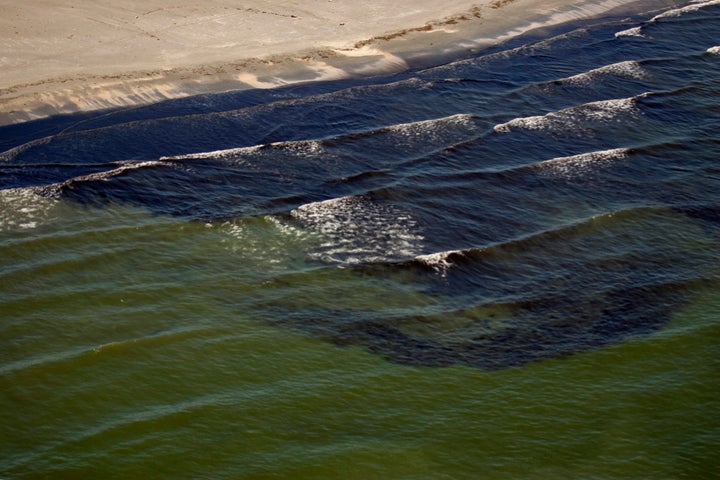 Oil from the Deepwater Horizon spill is visible in the surf off Fourchon Beach, Louisiana July 9, 2010.