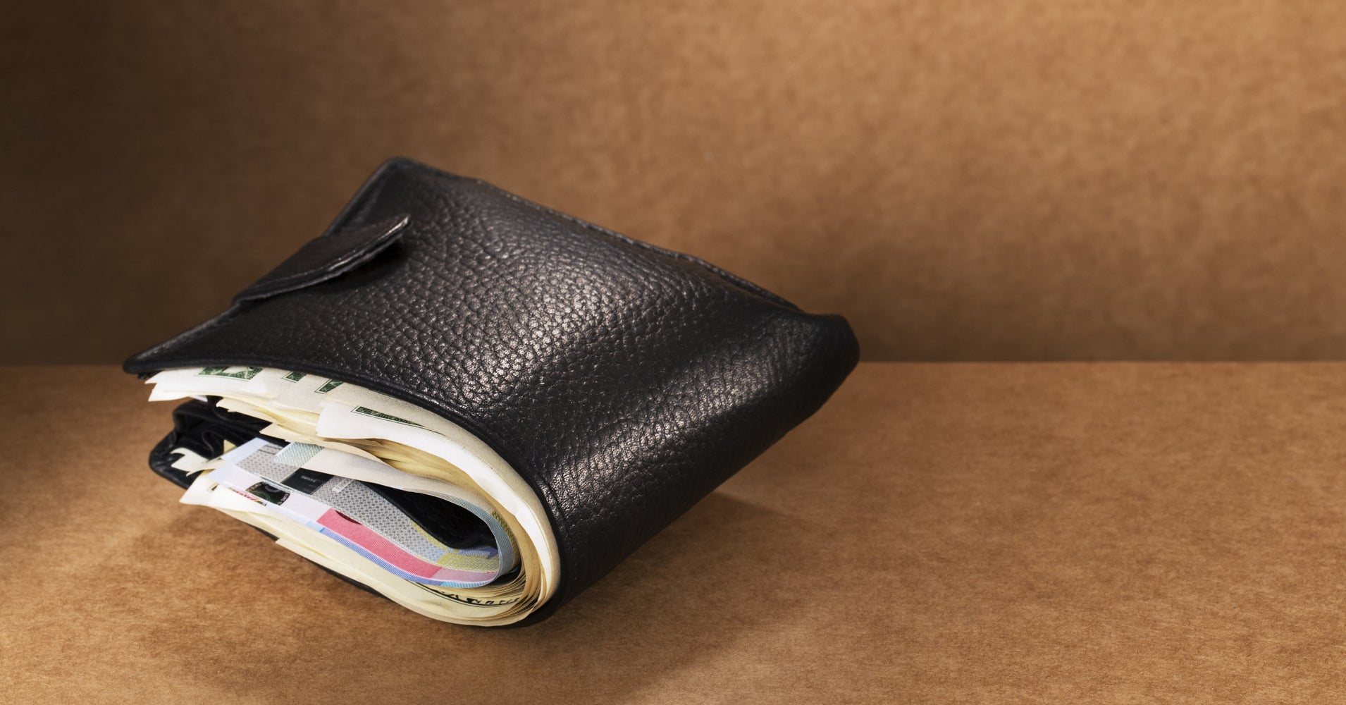 Your Giant Wallet Could Be Giving You Back Problems. Here's How To Fix