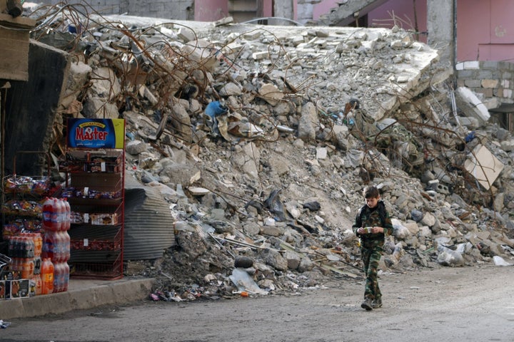 Members of activist group Deir Ezzor is Being Slaughtered Silently say they have discovered mass graves containing the r