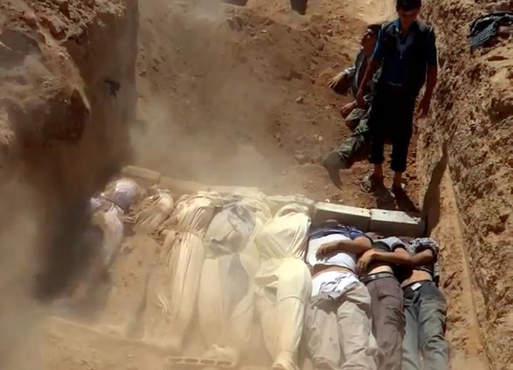The activists say the mass graves may be the result of atrocities carried out by ISIS as well as by government forces. A video screen grab appears to show a mass grave with victims that rebels claim were killed in an attack outside Damascus.