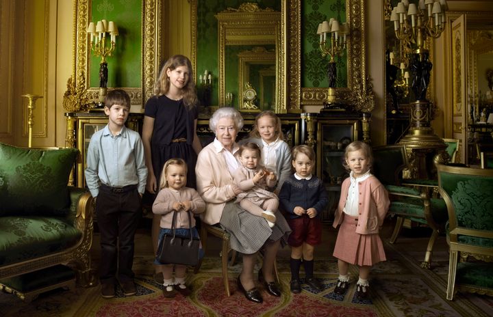 This official photograph, released by Buckingham Palace to mark her 90th birthday, shows the Queen with her five great-grandchildren and her two youngest grandchildren