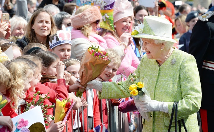Britain's Queen Elizabeth II greeted thousands of well-wishers as she celebrated her 90th birthday during a lengthy walkabout