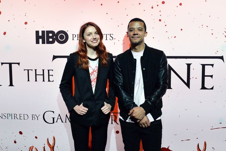 Jacob Anderson, right, and Hannah Murray, left, appear at HBO's "Art the Throne" event in New York on April 20. 