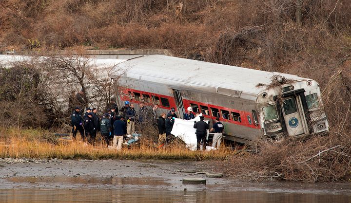 Emergency workers at the Metro-North commuter train derailment on Dec. 1, 2013, in the Bronx, which was linked to an engineer's undiagnosed sleep apnea.
