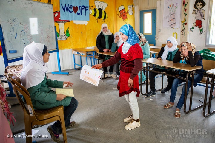 15-year-old Syrian refugee Omaima at a drawing class she teaches to raise awareness of the dangers of early marriage at Za'atari refugee camp.