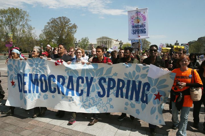 About 100 lawmakers responded to the Democracy Spring protests with a call for hearings on the legislation endorsed by protesters.