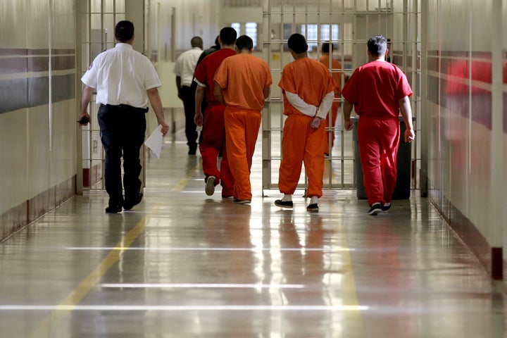 Detainees at Stewart Detention Center in Lumpkin, Ga., are escorted through a corridor in this file photo. The center is the site of a hunger strike. 