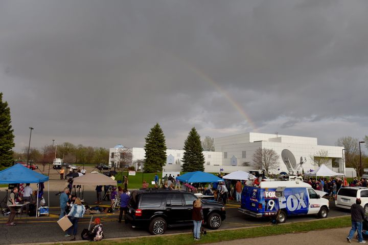 A rainbow emerges over Paisley Park in Chanhassen, Minn., while fans pay respect to singer Prince.
