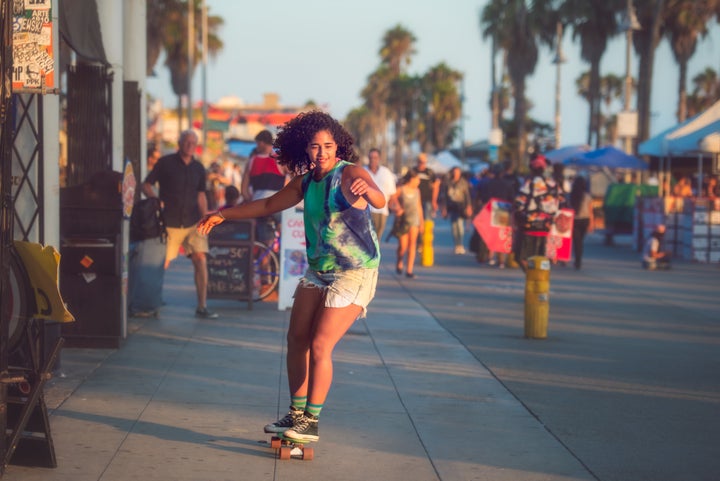 Skateboarding on the Venice Beach boardwalk.