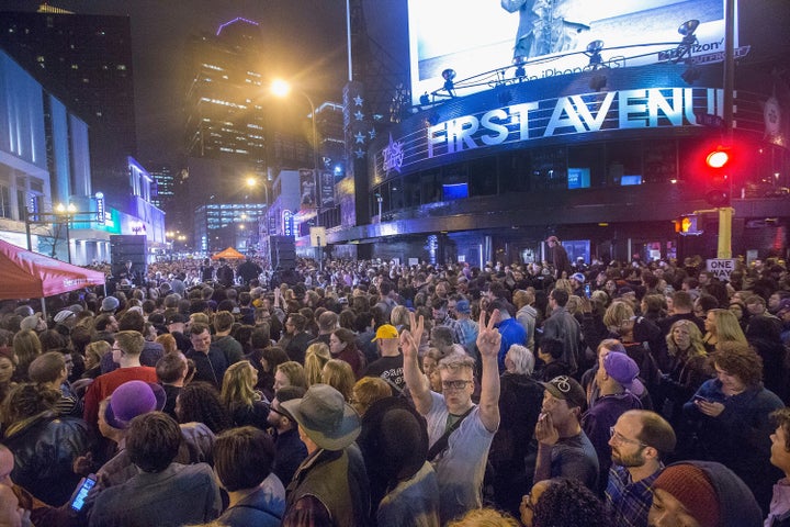 <strong>People listen to Prince music during a memorial street party outside the First Avenue nightclub</strong>