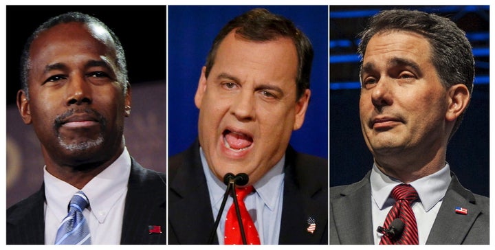 Former presidential candidate Ben Carson (L), Governor of New Jersey Chris Christie (C), and Governor of Wisconsin Scott Walk