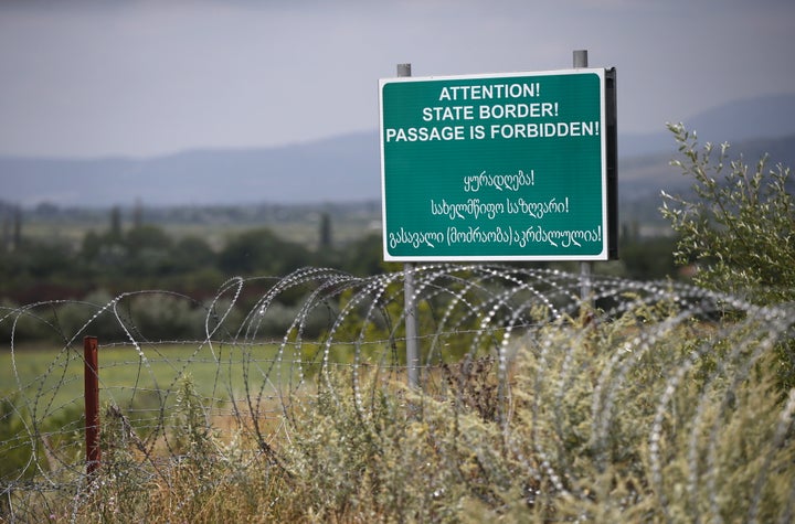 A warning sign placed along the border Russia has enforced between Georgia and South Ossetia.