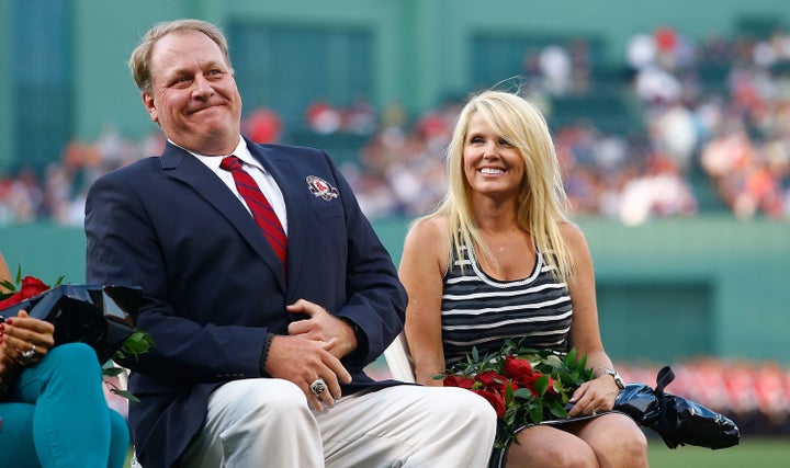 Former Boston Red Sox pitcher Curt Schilling sits with his wife, Shonda Schilling, while being inducted into the Red Sox Hall of Fame in 2012.