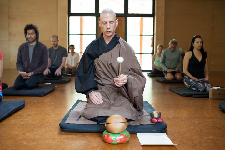 A Buddhist leader at California's Tassajara Zen Mountain Center leads a group through a meditation.