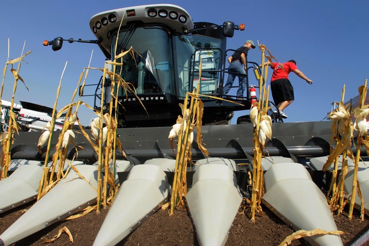 Young farmers enjoy a combine exhibit at the 2011 Farm Progress Show in Decatur, Illinois.