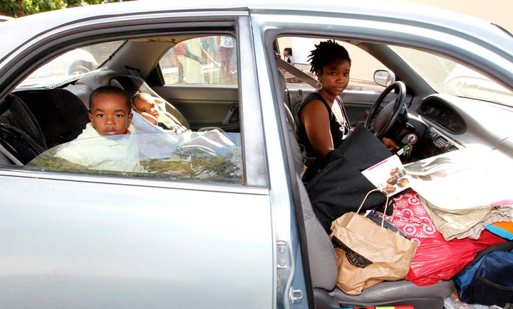 Debbie Summers and her children sit in her car, with all of their possessions, as they wait for admittance to a homeless shelter in Florida. In 2011, 1.6 million children were homeless in the United States last year.