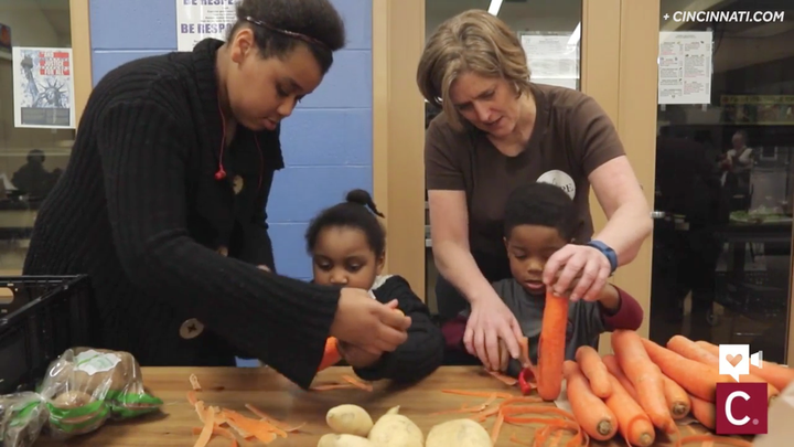 DeYoung teaches kids how to peel vegetables in one of her classes.