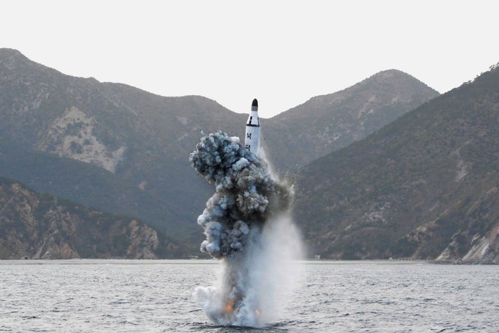 North Korean leader Kim Jong Un guides the underwater test-fire of strategic submarine ballistic missile in this undated phot