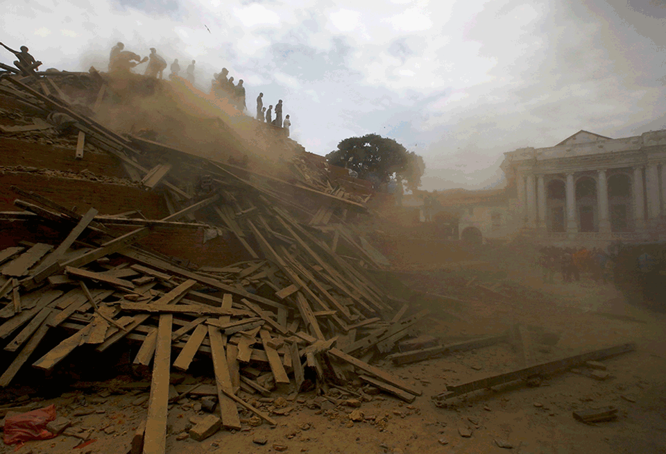 Building debris in Kathmandu's Durbar Square is cleared in the months after the April 25 earthquake. Nepal is slowly rebuilding after two earthquakes hit the country last year.