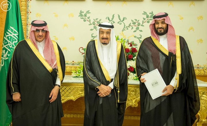Saudi Crown Prince Mohammed bin Nayef, Saudi King Salman, and Saudi Arabia's Deputy Crown Prince Mohammed bin Salman stand together after Saudi Arabia's cabinet agrees to implement a broad reform plan known as Vision 2030 in Riyadh, April 25, 2016.