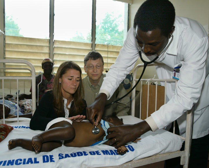 Bill and Melinda Gates visit a young patient suffering from malaria in the Manhica Research Center and hospital in 2003 in Mozambique.