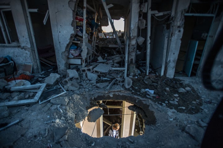 A damaged house is seen after rocket projectiles hit the roof of a house in Kilis, Turkey, on April 18. At least three Syrian