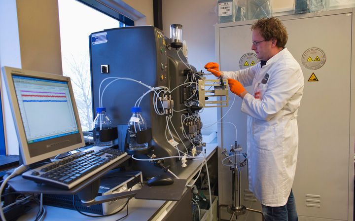 An operator installs a chromatography column to purify the gene therapy drug Glybera at Dutch biotech company uniQure.