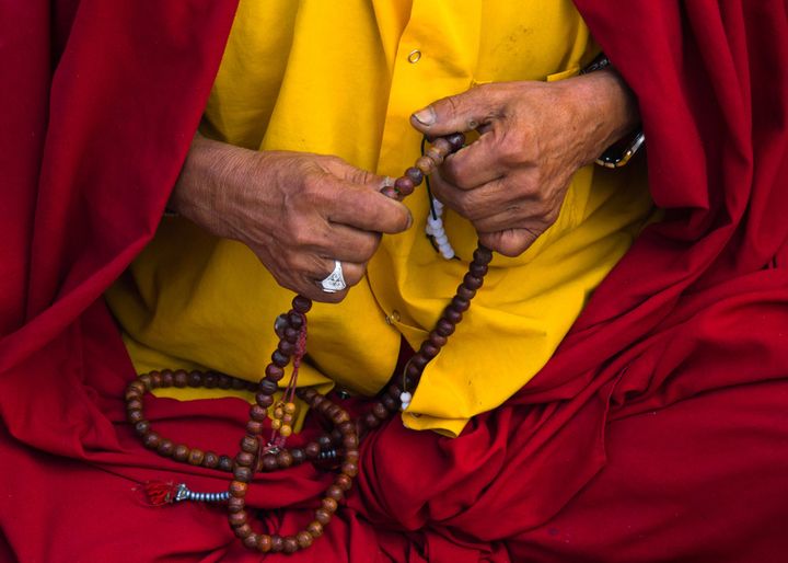A Buddhist monk with his prayer chain.