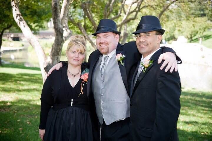Andrew, center, with his ex-mother-in-law Sibrina, and ex-father-in-law Tom.
