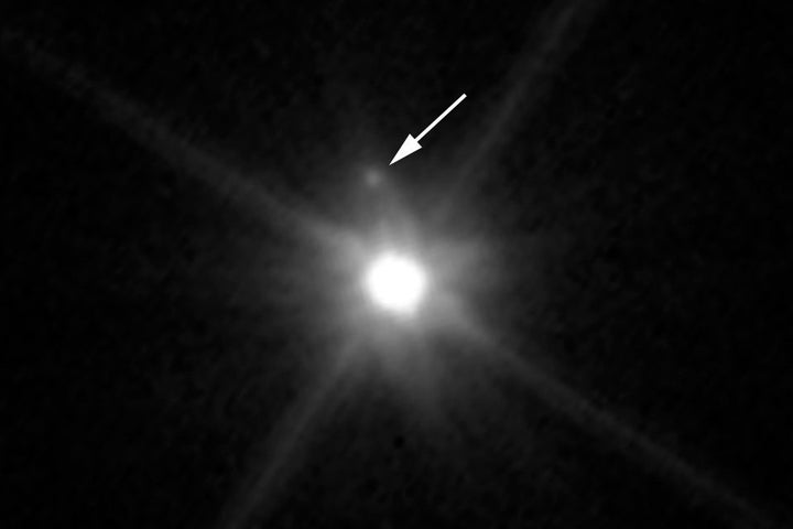 This Hubble Space Telescope image reveals the first moon ever discovered around the dwarf planet Makemake. The tiny moon, located just above Makemake in this image, is barely visible because it is almost lost in the glare of the very bright dwarf planet.