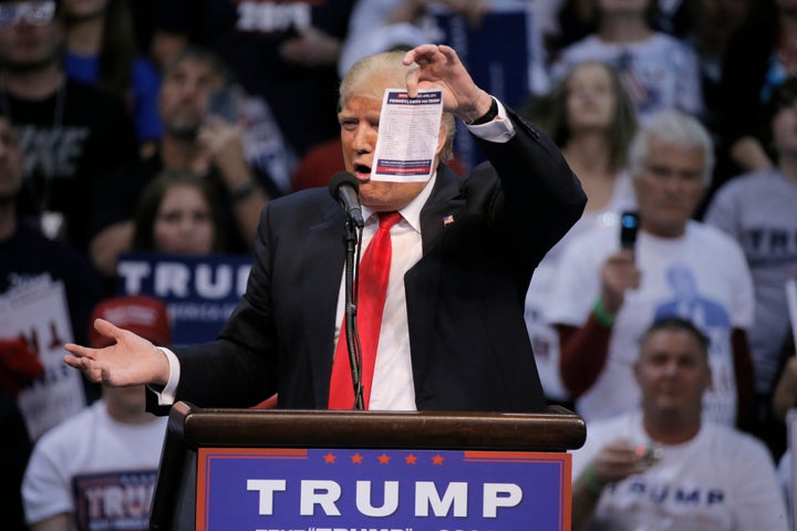 Republican U.S. presidential candidate Donald Trump shows the delegates list for the Pennsylvania state primary election duri