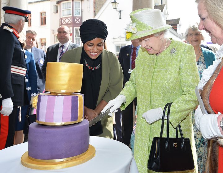 Nadiya presents the Queen with a cake she had made for her 90th birthday last week.