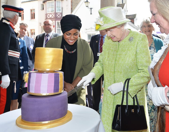 <strong>Nadiya presents the Queen with a cake she had made for her 90th birthday last week.</strong>