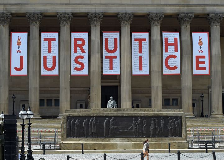 A giant banner was unveiled at St George's Hall in Liverpool