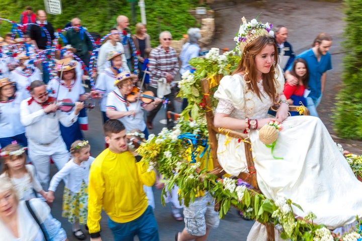 A May Queen leads a procession