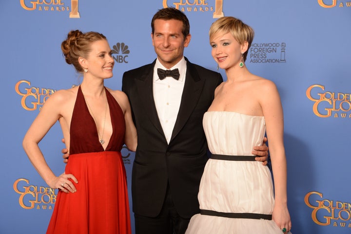 Amy Adams and Jennifer Lawrence pose with a man who earned more money than them for doing the same job in the same