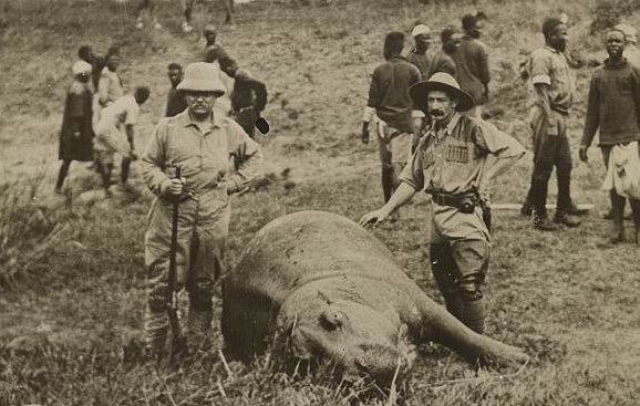 What's more manly than renowned outdoorsman Theodore Roosevelt standing with a rifle next to a dead hippopotamus?