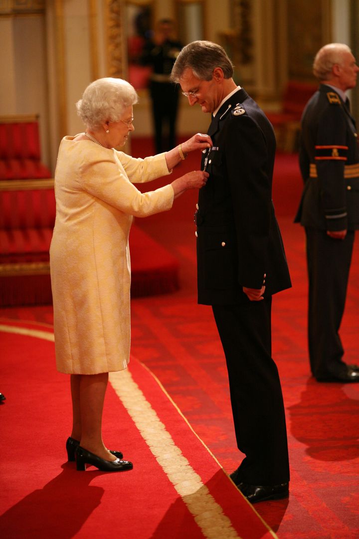 David Crompton is decorated with The Queen's Police Medal by The Queen at Buckingham Palace in November 2010.
