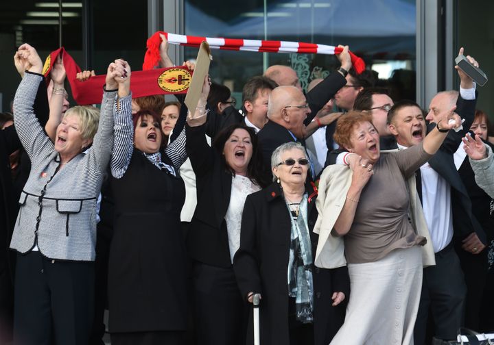 Relatives of those who died in the Hillsborough disaster sing 'You'll Never Walk Alone' outside the Hillsborough inquest on Tuesday.