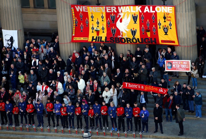 Family members of the Hillsborough victims attend a commemorative event at St George's Hall in Liverpool.